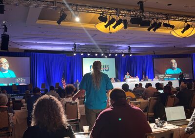 OPEIU Local 8 member standing up and speaking at the International Convention