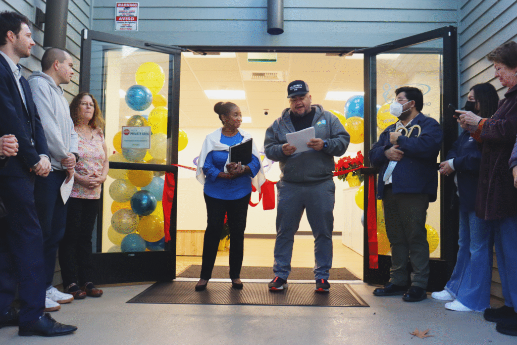 OPEIU Local 8 Vice President Emmanuel Flores introducing President Sara Franklin before the ribbon cutting ceremony.